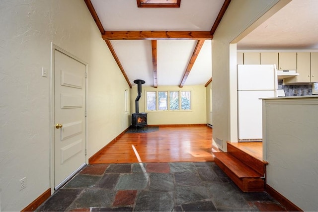 hall featuring dark hardwood / wood-style floors and beamed ceiling