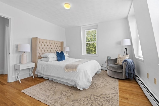 39 School St Unit 39, Brookline, MA 02446 - bedroom with a baseboard heating unit and wood finished floors
