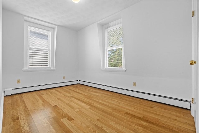 39 School St Unit 39, Brookline, MA 02446 - unfurnished room with wood finished floors and a baseboard radiator