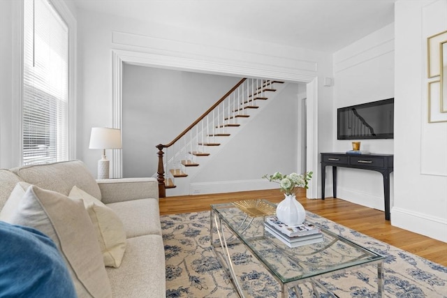 39 School St Unit 39, Brookline, MA 02446 - living room featuring wood finished floors, stairs, and baseboards
