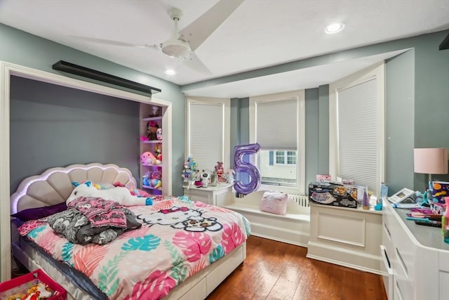 bedroom with recessed lighting, ceiling fan, and wood-type flooring
