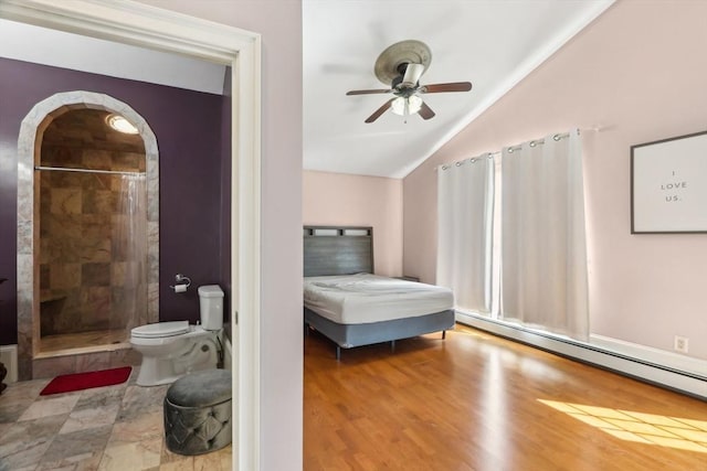 bedroom with baseboard heating, vaulted ceiling, wood finished floors, ceiling fan, and arched walkways
