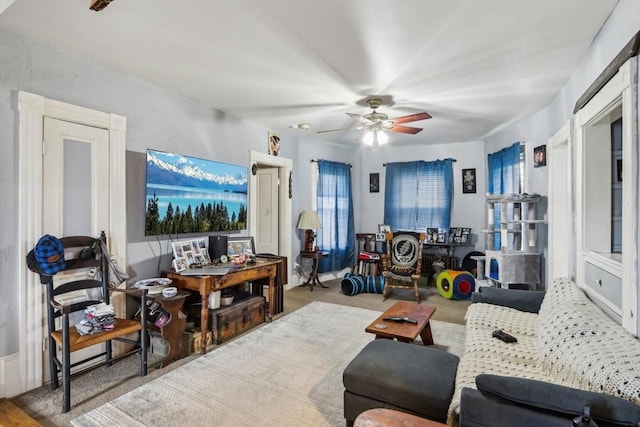 living area with ceiling fan