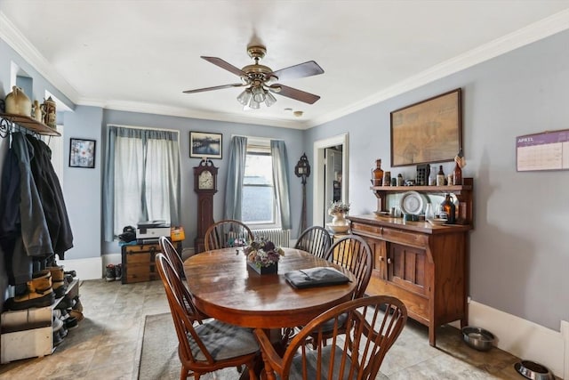 dining room featuring a ceiling fan and ornamental molding