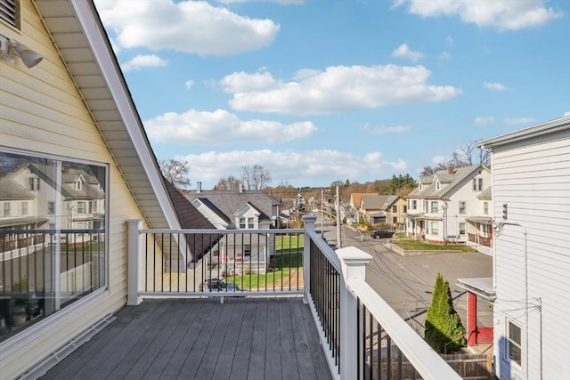 wooden deck with a residential view