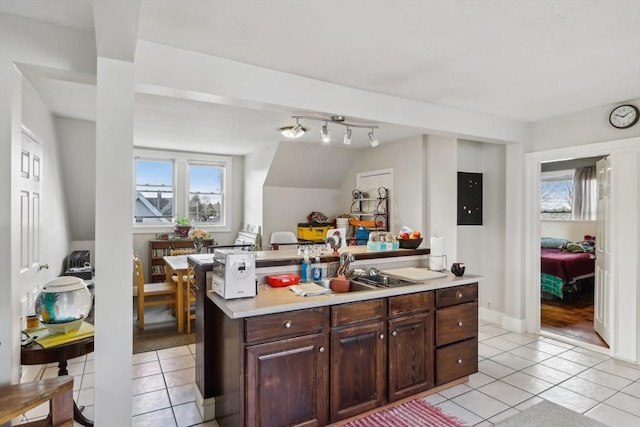 kitchen featuring light countertops, a wealth of natural light, and light tile patterned floors