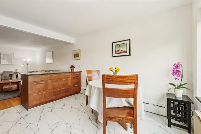 128 Pleasant St Unit 407, Arlington, MA 02476 - dining space featuring light marble finish flooring, baseboard heating, and a baseboard heating unit