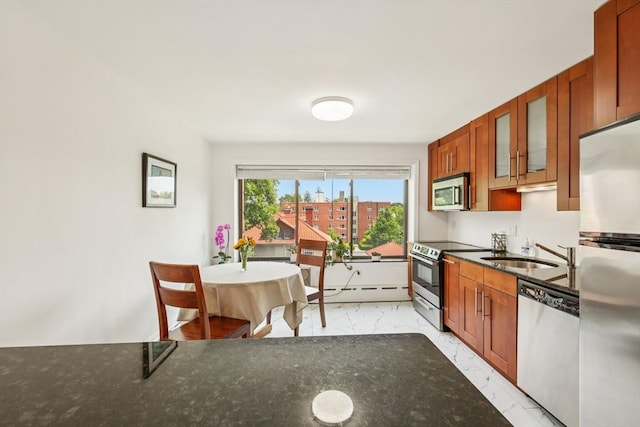 128 Pleasant St Unit 407, Arlington, MA 02476 - kitchen with stainless steel appliances, a sink, light marble finish floors, a baseboard radiator, and glass insert cabinets
