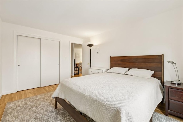 128 Pleasant St Unit 407, Arlington, MA 02476 - bedroom featuring wood finished floors and a closet