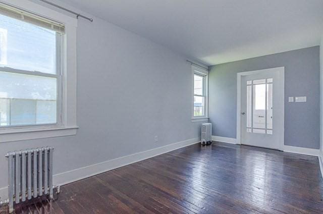 17 Harrison St, New Bedford, MA 02740 - spare room with radiator, hardwood / wood-style flooring, and baseboards