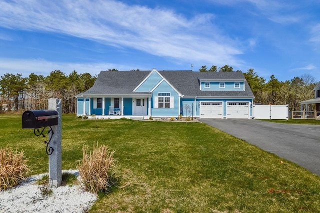 8 Dylans, Falmouth, MA 02536 - view of front of house featuring driveway, covered porch, a garage, and a shingled roof