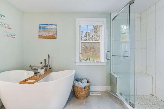 8 Dylans, Falmouth, MA 02536 - bathroom featuring a stall shower, a soaking tub, baseboards, and tile patterned flooring