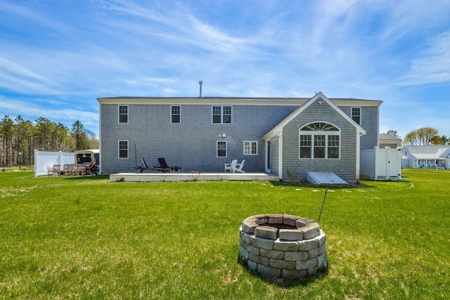 8 Dylans, Falmouth, MA 02536 - back of house with a fire pit and a patio