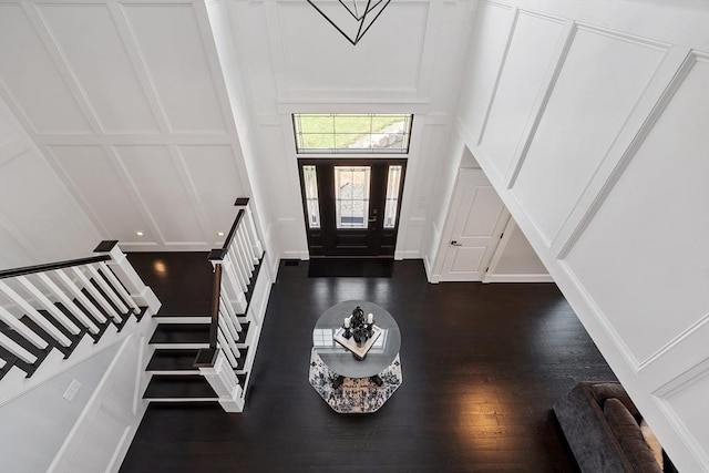 3 Toronto Ave, Gloucester, MA 01930 - foyer entrance featuring a decorative wall, stairway, dark wood-style flooring, and a high ceiling