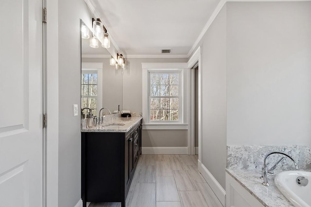 3 Toronto Ave, Gloucester, MA 01930 - bathroom with vanity, crown molding, a bath, and baseboards