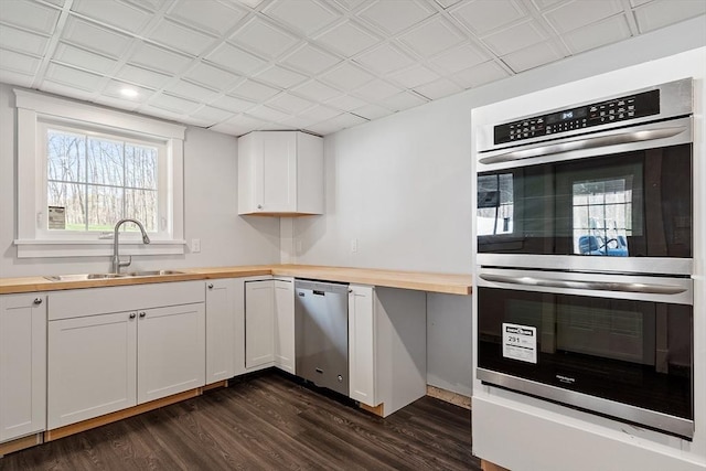 3 Toronto Ave, Gloucester, MA 01930 - kitchen with butcher block counters, stainless steel appliances, a sink, dark wood finished floors, and plenty of natural light