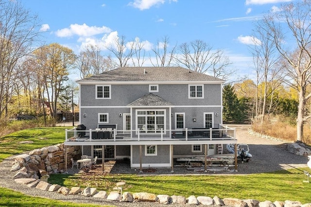 3 Toronto Ave, Gloucester, MA 01930 - back of property featuring a wooden deck, a patio area, and a yard