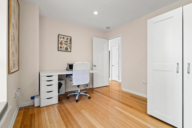 office space with light wood-style flooring, baseboards, and recessed lighting