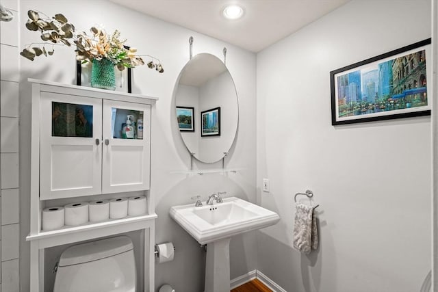 bathroom featuring toilet and recessed lighting