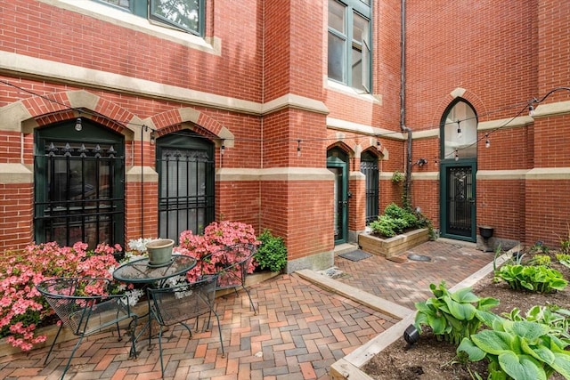 property entrance with brick siding