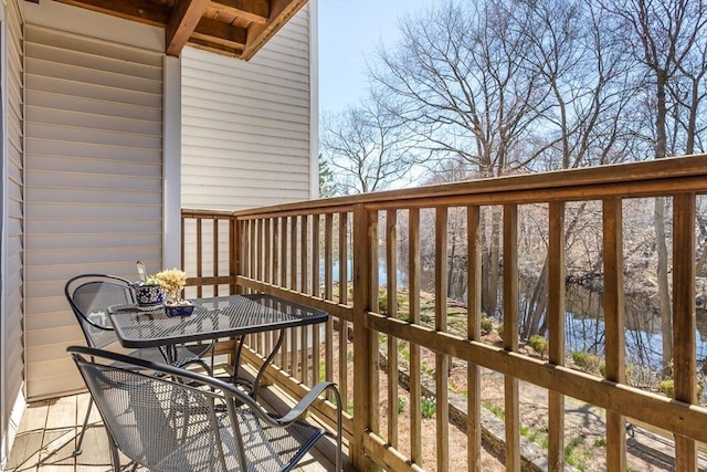 balcony with a deck with water view