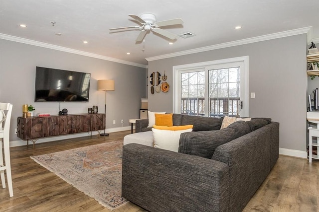 living room featuring dark wood-type flooring and ornamental molding