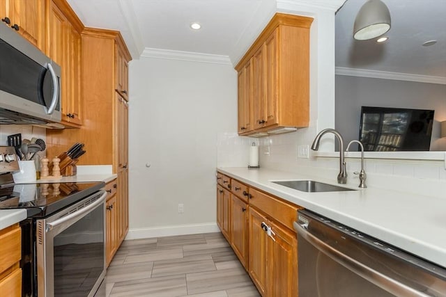 kitchen with tasteful backsplash, sink, ornamental molding, and appliances with stainless steel finishes