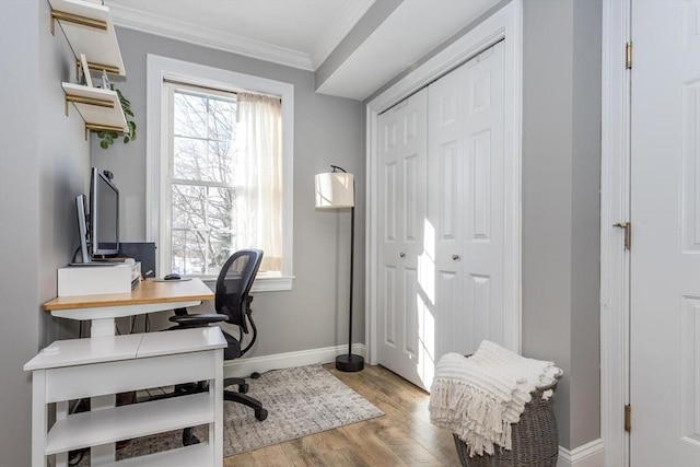 office featuring ornamental molding and light wood-type flooring