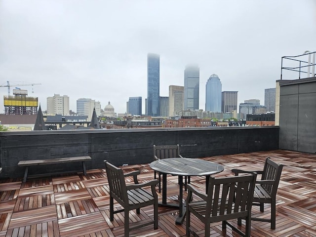 wooden terrace with a view of skyline