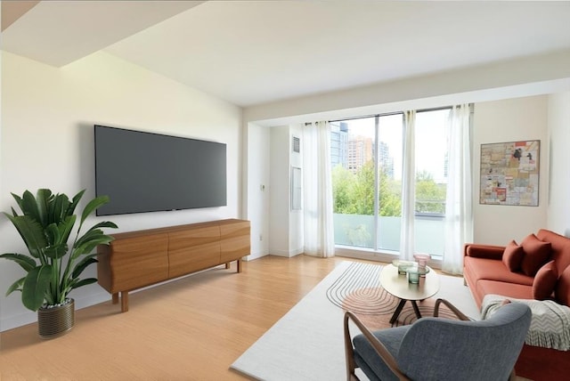 living room with light wood-style floors and baseboards