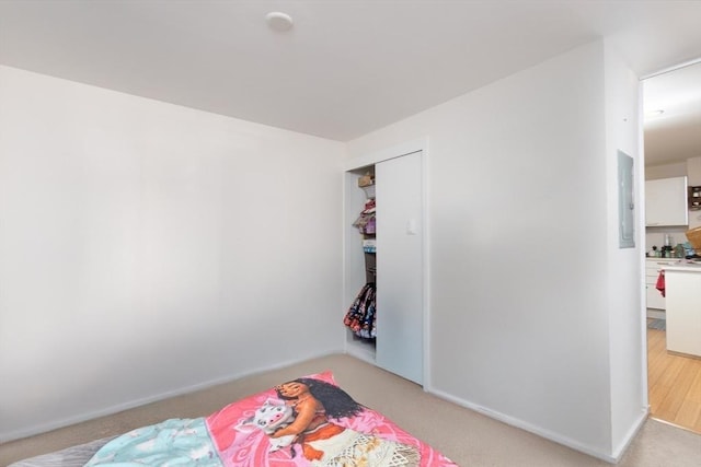 bedroom with light colored carpet