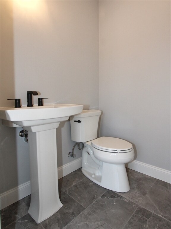 bathroom featuring toilet