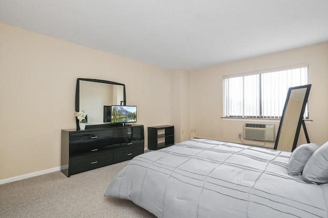 131 Coolidge Ave Unit 422, Watertown, MA 02472 - bedroom featuring baseboards, a wall mounted AC, and carpet