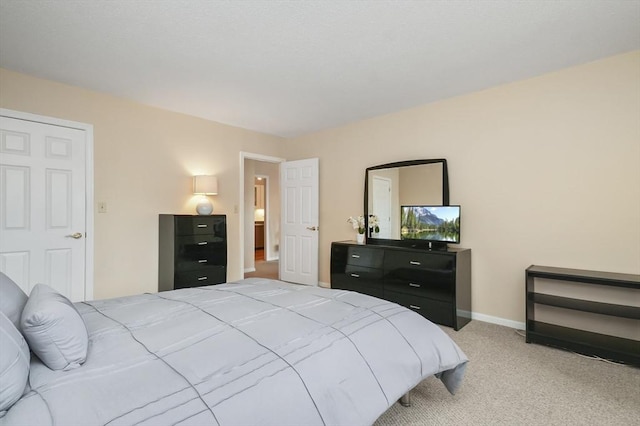 131 Coolidge Ave Unit 422, Watertown, MA 02472 - bedroom featuring baseboards and light carpet