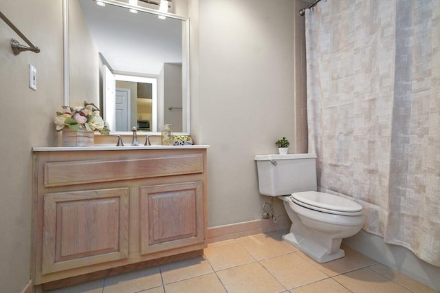 131 Coolidge Ave Unit 422, Watertown, MA 02472 - bathroom with tile patterned flooring, curtained shower, toilet, and vanity
