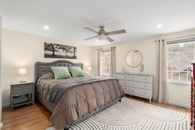 bedroom featuring recessed lighting, baseboards, visible vents, and light wood-style flooring