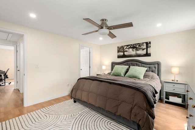 bedroom with attic access, recessed lighting, baseboards, and light wood finished floors