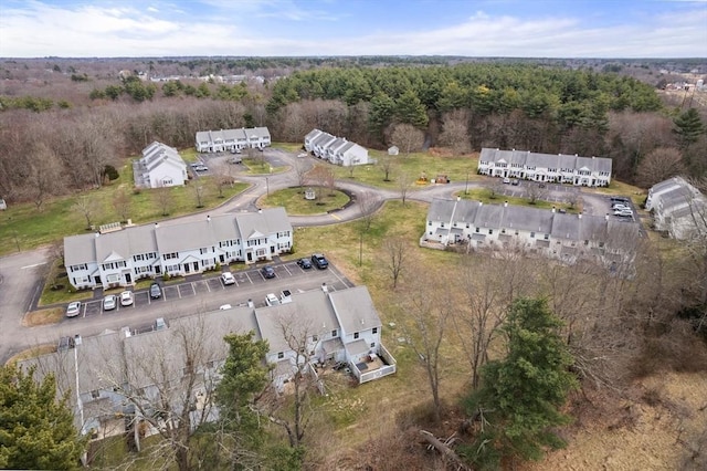 drone / aerial view featuring a view of trees