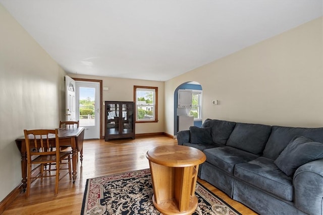 16 Elm St, Leominster, MA 01453 - living area with light wood-style flooring, arched walkways, and baseboards