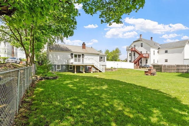 16 Elm St, Leominster, MA 01453 - rear view of property with stairs, a deck, and a chimney