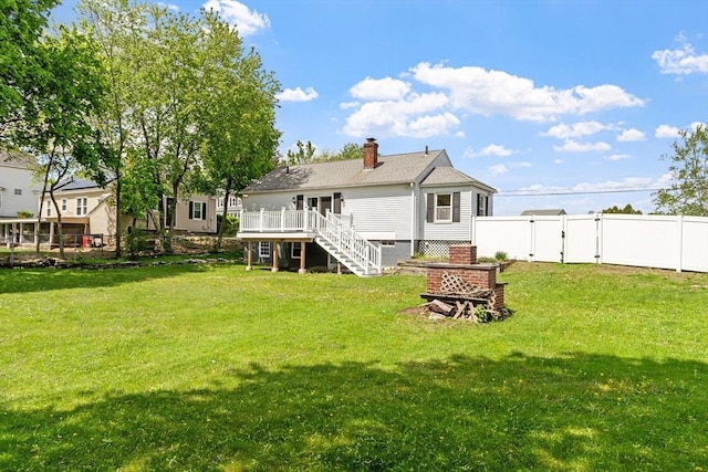 16 Elm St, Leominster, MA 01453 - back of property featuring stairway, a gate, a wooden deck, and a chimney