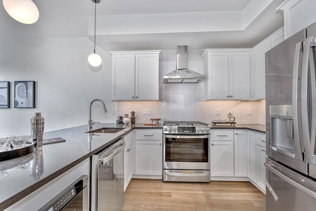 116 Moore St Unit 305, Boston, MA 02128 - kitchen with stainless steel appliances, wall chimney exhaust hood, a sink, and white cabinetry