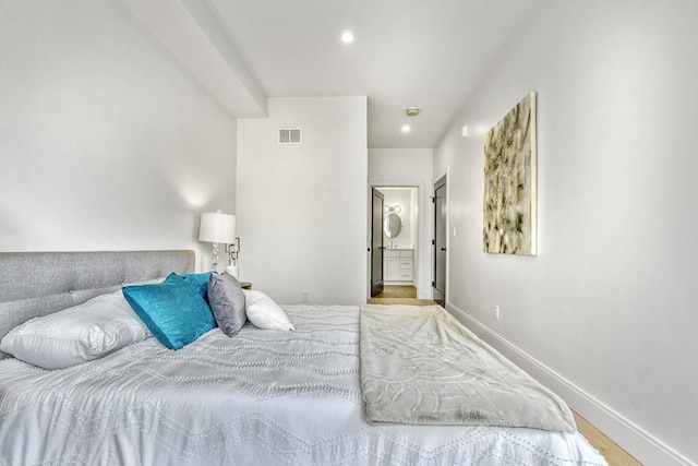 116 Moore St Unit 305, Boston, MA 02128 - bedroom with recessed lighting, baseboards, ensuite bath, and wood finished floors