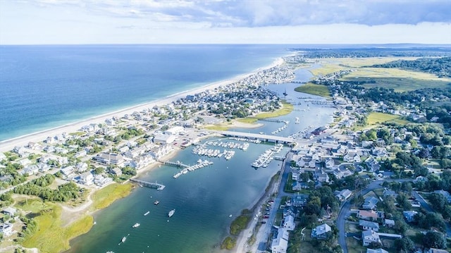 aerial view with a water view and a view of the beach