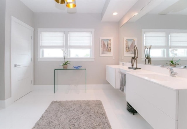bathroom featuring double vanity, tile patterned floors, recessed lighting, and a sink
