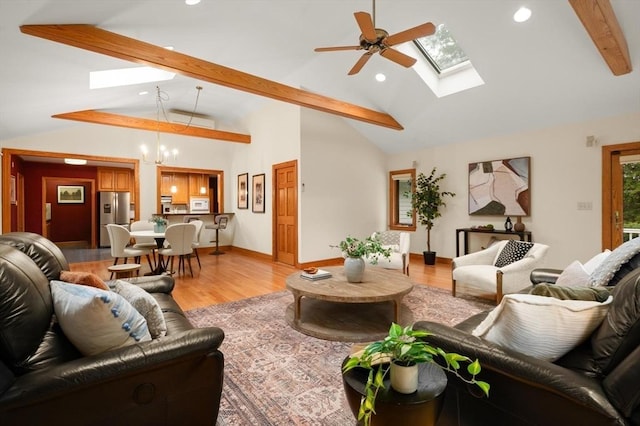 living room featuring a skylight, beam ceiling, recessed lighting, light wood finished floors, and high vaulted ceiling