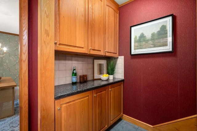 bar with backsplash, wallpapered walls, and tile patterned floors