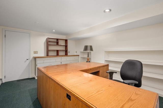 office space with dark carpet, recessed lighting, and built in shelves