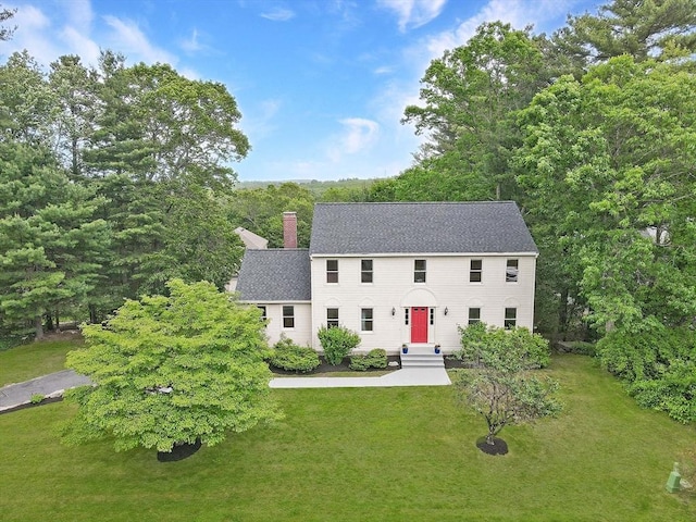 37 Annetta Rd, Ashland, MA 01721 - colonial-style house with a front lawn, a chimney, and a shingled roof
