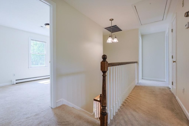 37 Annetta Rd, Ashland, MA 01721 - corridor with attic access, carpet, a baseboard heating unit, an upstairs landing, and baseboards